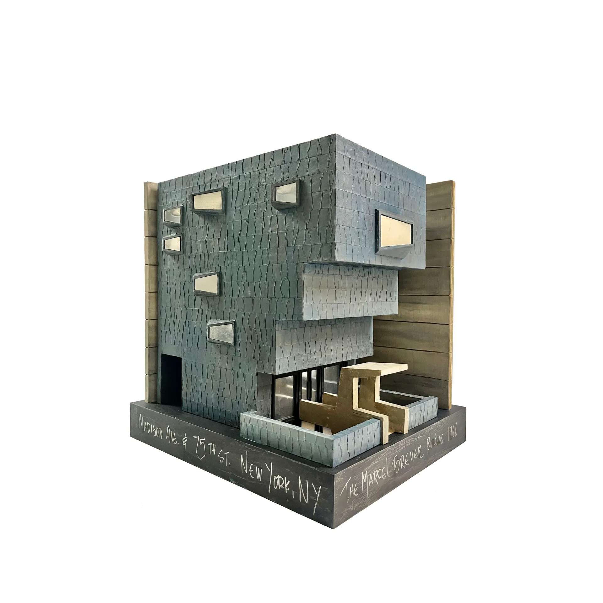 The Marcel Breuer Building sculpture by Roberto Cardinale, showing the inverted-ziggurat facade cantilevered over Madison Avenue and its angled windows.
