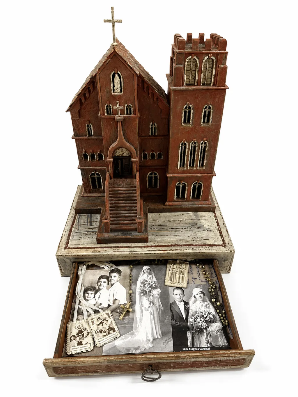 The sculpture with the base drawer open, showing PJ Cardinale’s collage with the 1935 wedding photographs of the artist’s parents.