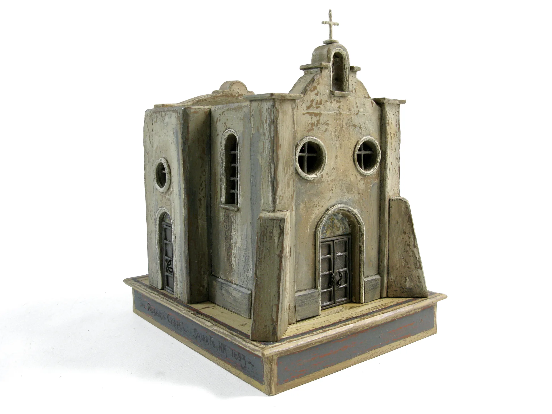 The Rosario Chapel sculpture by Roberto Cardinale, three-quarter view of the adobe chapel’s front facade with its bell gable and cross.