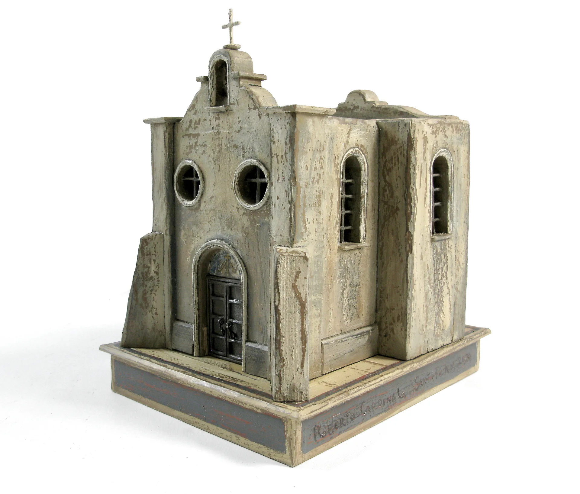 The Rosario Chapel sculpture seen from the front right, showing the arched entry and side windows.