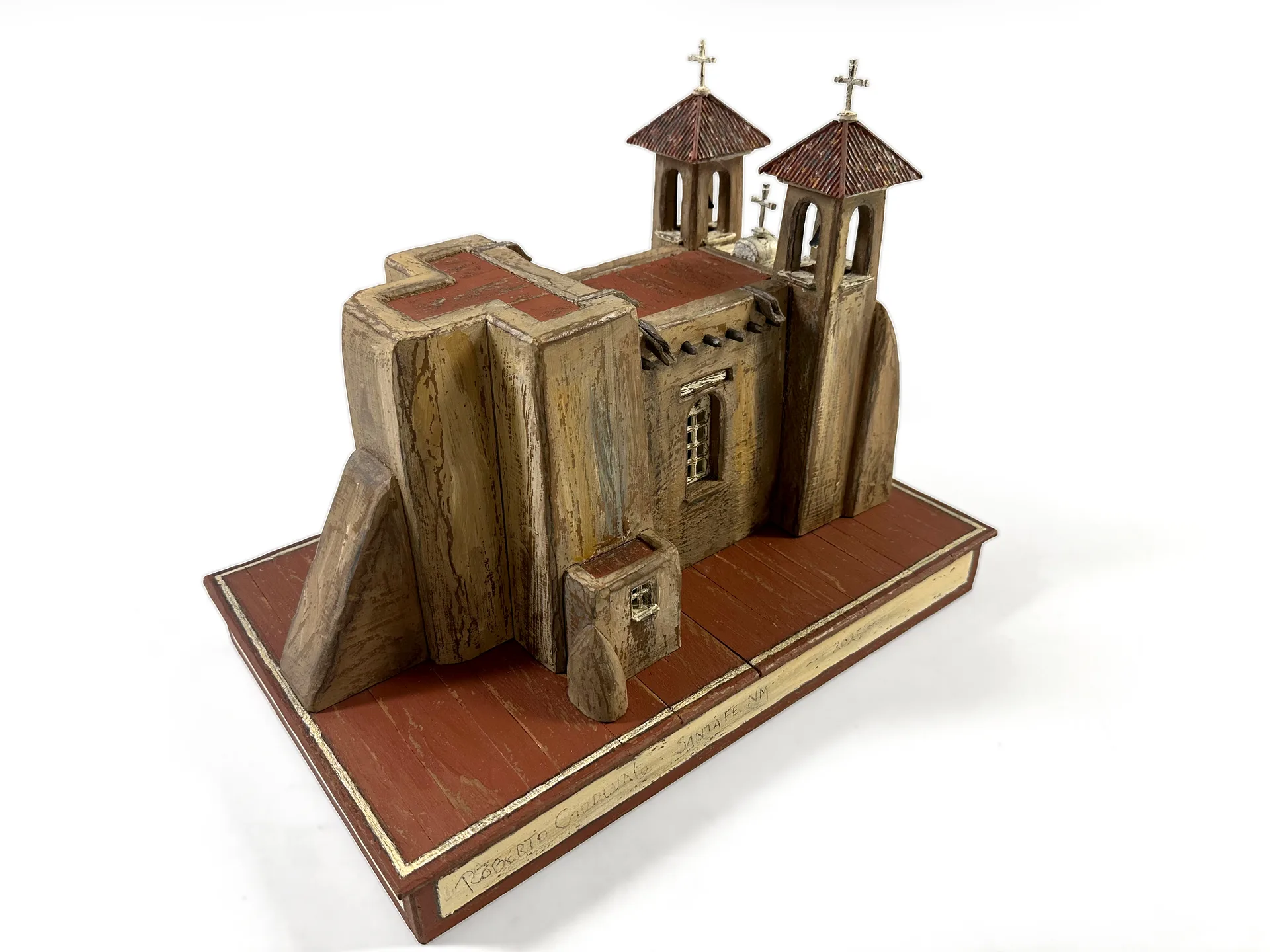 The apse of the San Francisco de Asis sculpture, showing the stepped adobe buttresses from the side.
