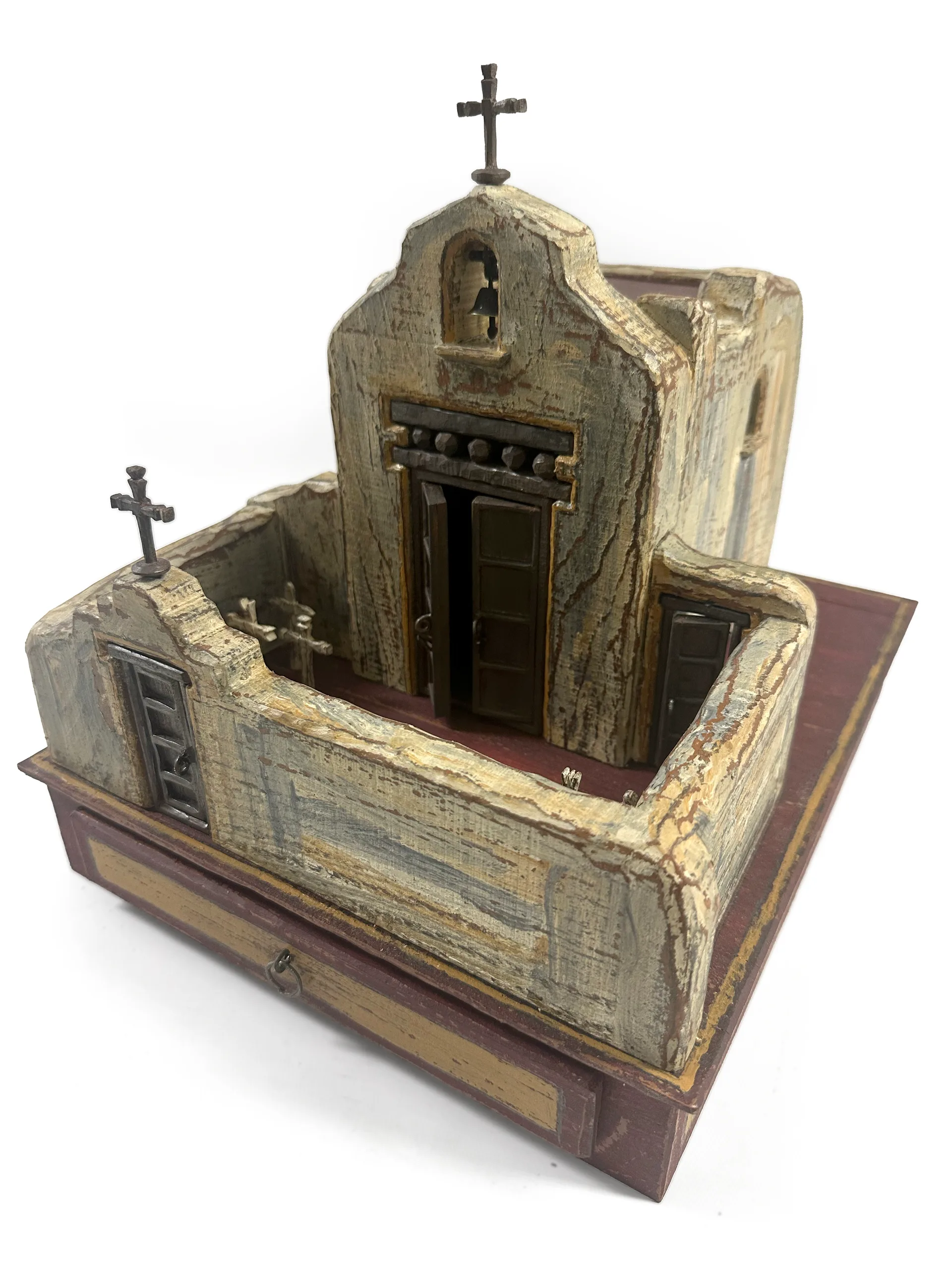 The Talpa Chapel sculpture by Roberto Cardinale, showing the curved adobe parapet, the bell cross and the walled courtyard.